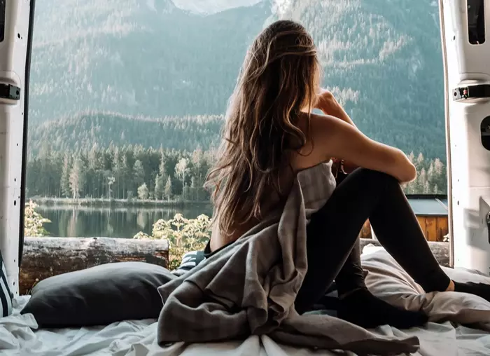 Woman looking out on window